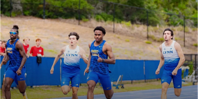 High school runners competing in a track race.