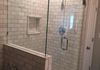 Custom Frameless Shower Door with Step Up and 90 Degree Return Panel