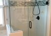 Custom Frameless Shower Door with Step Up and 90 Degree Return