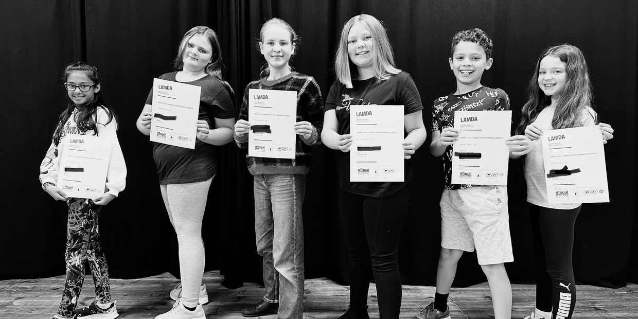 students smiling with their lamda certificates