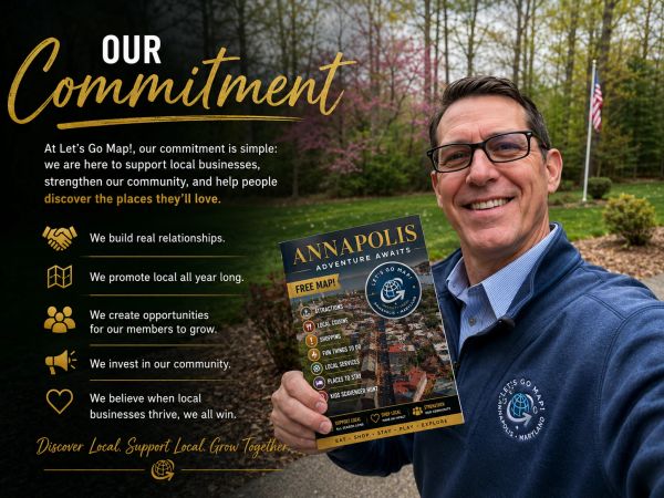 Man holding an Annapolis city guide promoting local support.