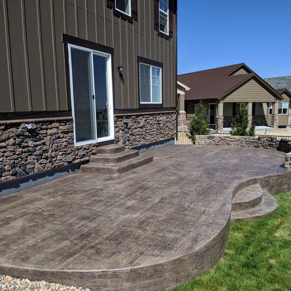 Stamped concrete patio and walkway installation by JC landscaping in Castle Rock Colorado