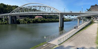 Modern bridge over a river on a clear day.