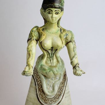 The Goddess figurine with arms stretched out in front of her. 