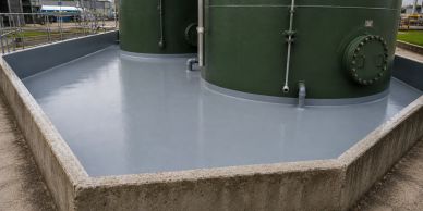 Industrial storage tanks on a concrete platform with a smooth surface.
