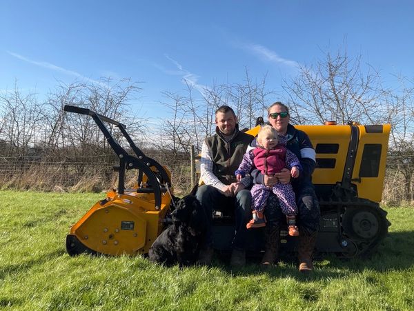 Family sat on yellow machine