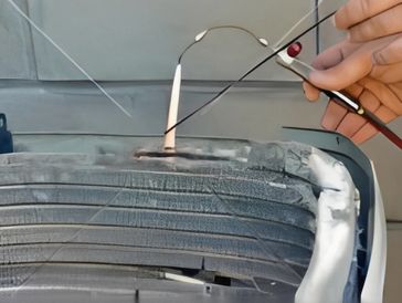 Close-up of a professional welding bead on a metal pipe.