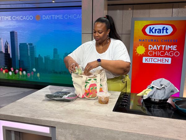A woman preparing food in the Daytime Chicago Kitchen studio.