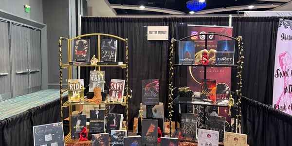 Author Brittni Brinkley book display at an event.