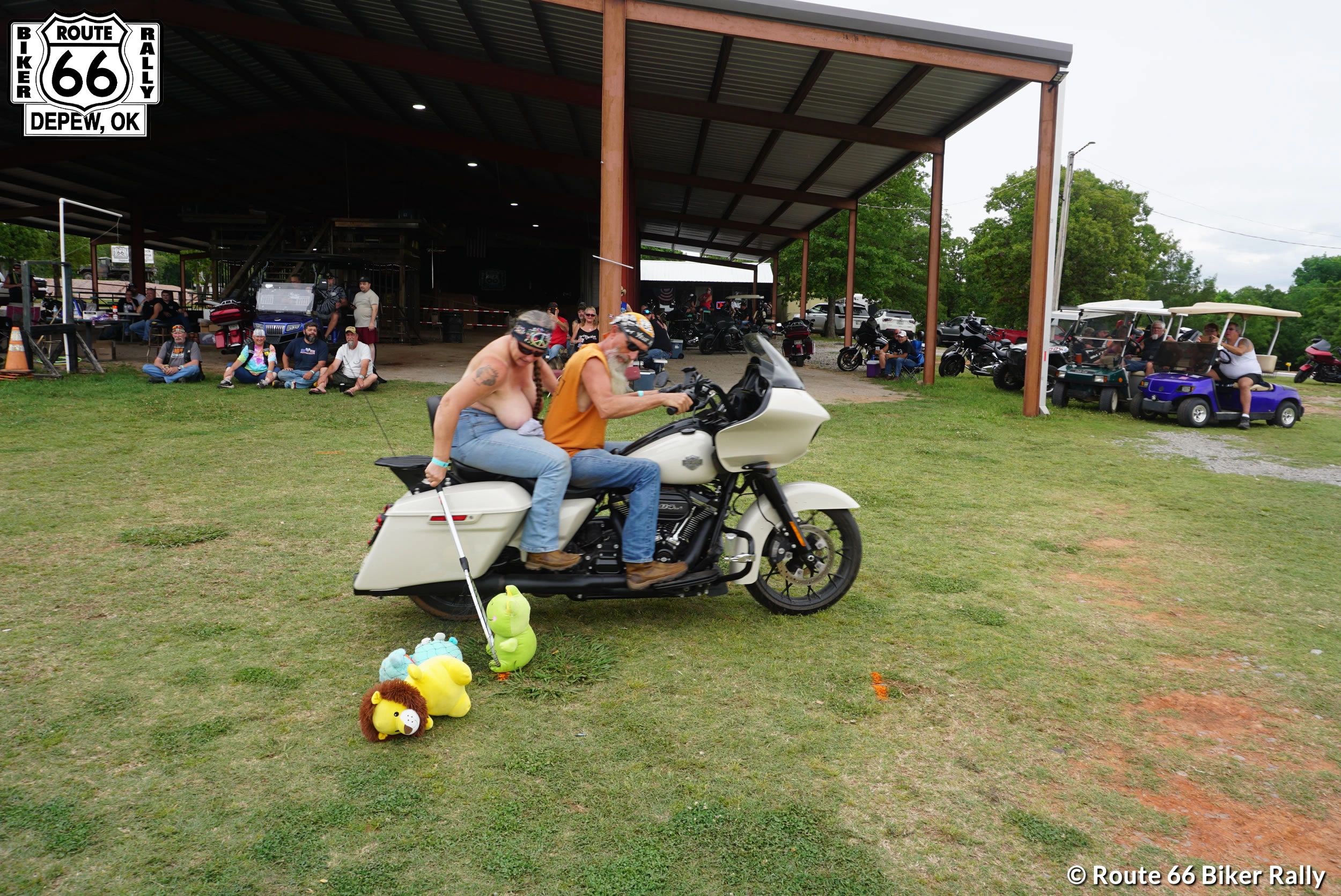 Two bikers riding a motorcycle at Route 66 Biker Rally in Depew, OK.