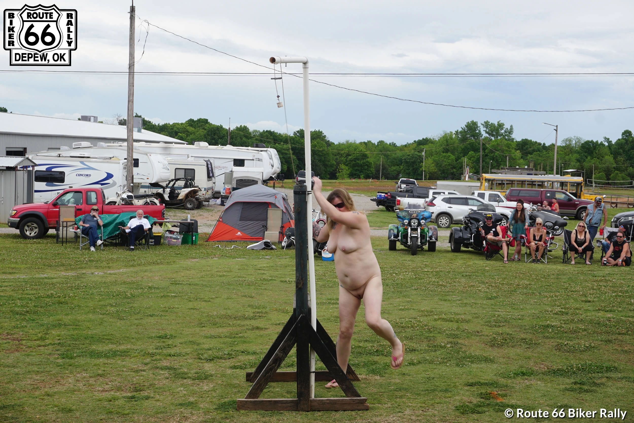 A topless woman playing a game at Route 66 Biker Rally in Depew, OK.