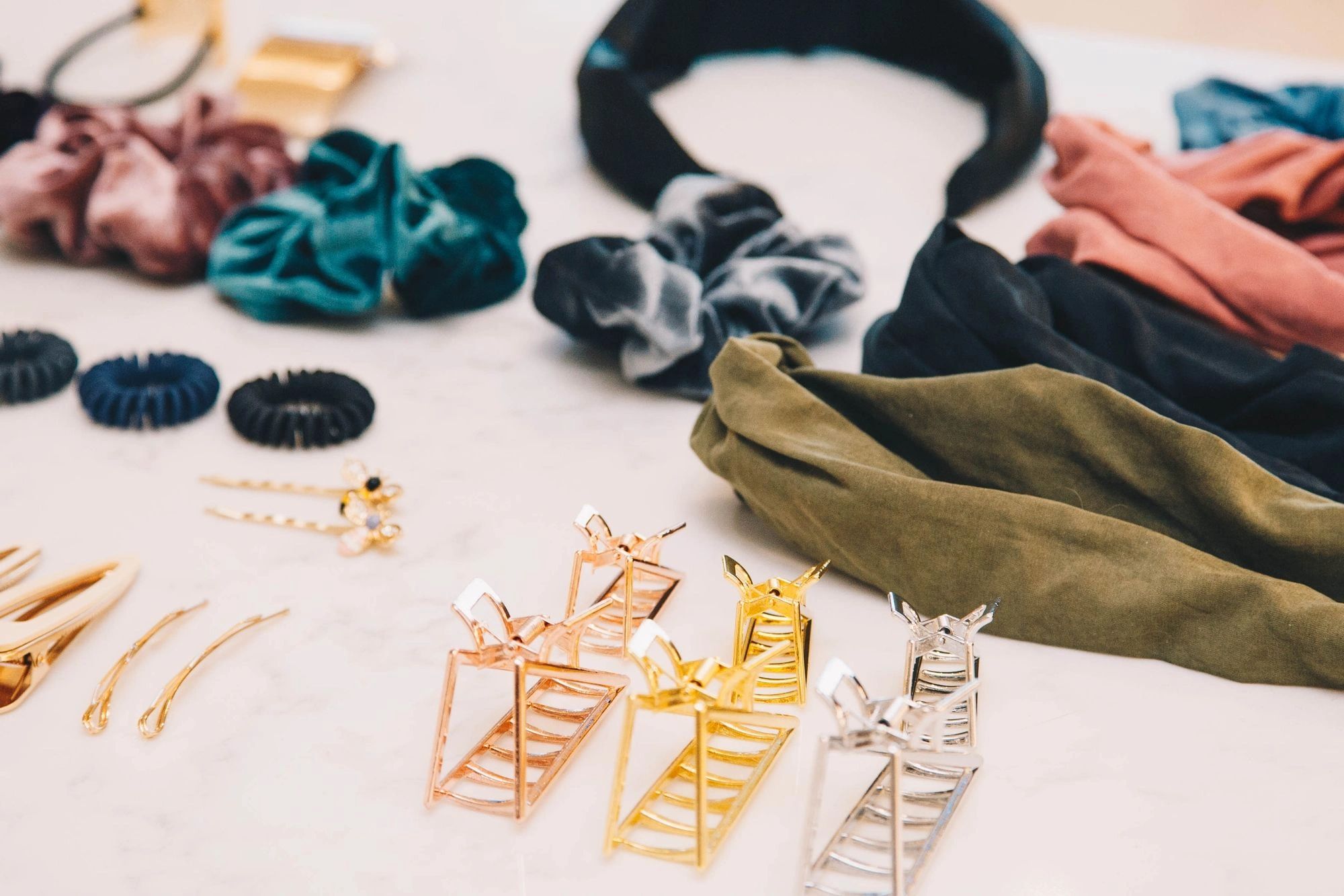 Colorful selection of luxury hair clips, scrunchies, hair ties, and headbands.