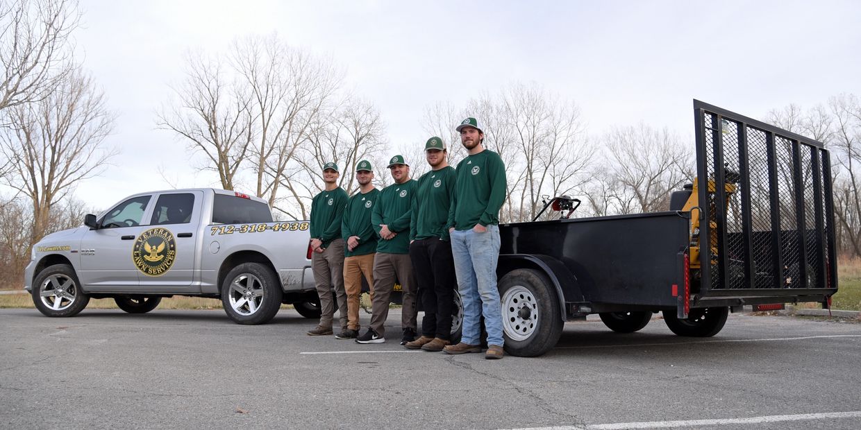 A group photo of Veteran Lawn Services Logo.