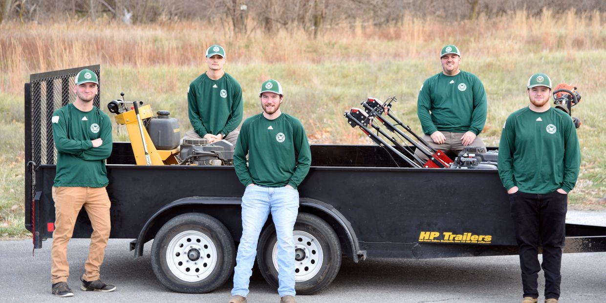 A group photo of Veteran Lawn Services.