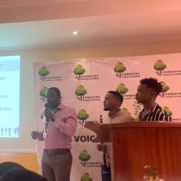Three men presenting at a Forestry event.