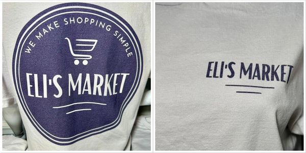 Beige Eli's Market t-shirts with front and back logos displayed on a mannequin and table.