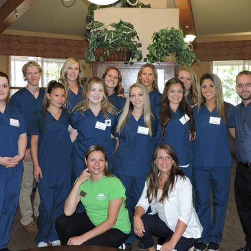 Faculty and students smiling getting ready for class 