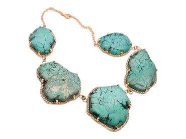 A necklace with five large turquoise stones linked by gold chain.