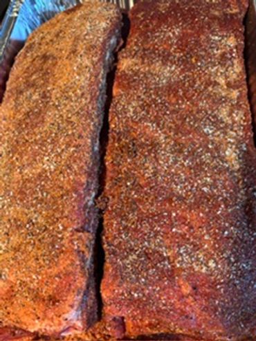 Two slabs of seasoned ribs.