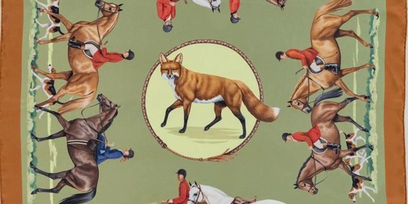 Fabric with fox and horseback riders in red jackets design.