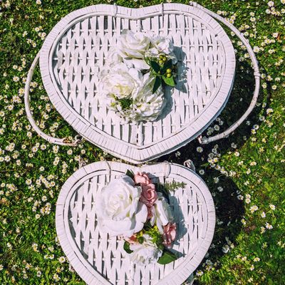 box on the yard with white roses on it 