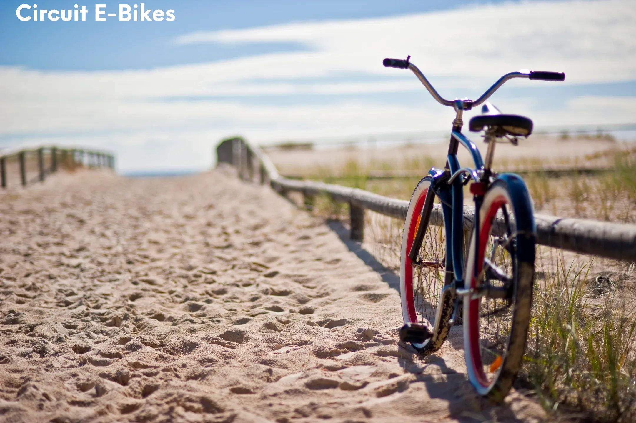 Vintage bicycle on a sandy path by the beach.