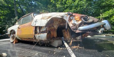 Wrecked triumph pulled out of the woods