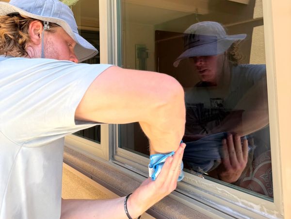 Walkers Window founder, owner, and technician - Joshua Walker, detail cleaning the seals and frames. 