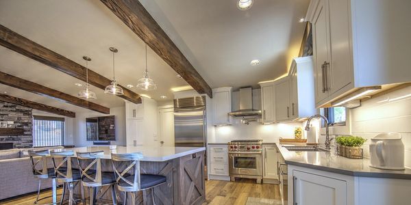 Rustic kitchen with beams, stained island, painted cabinets, custom cabinets