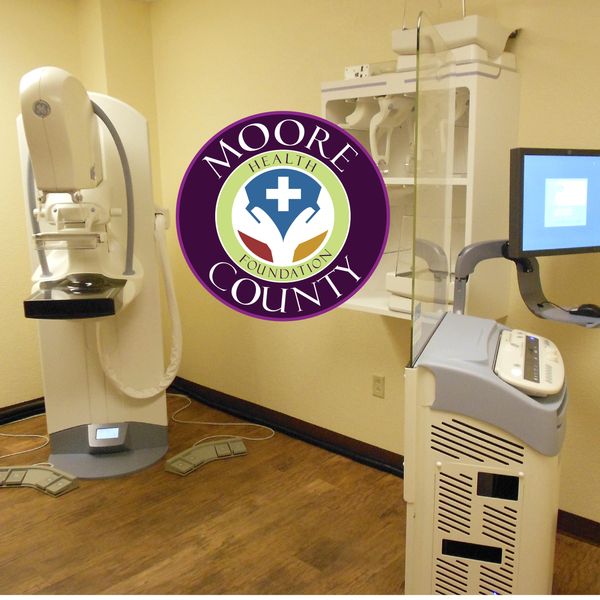 A photo of the digital mammography system provided by the MCHF.  The MCHF logo is included.