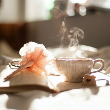 relaxing in a zen environment drinking tea while reading a book 