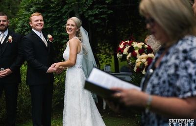 Couple smiling happily during their ceremony.