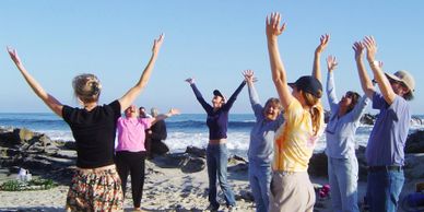 Group laughing arms up