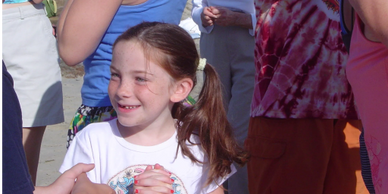 Child laughing in group