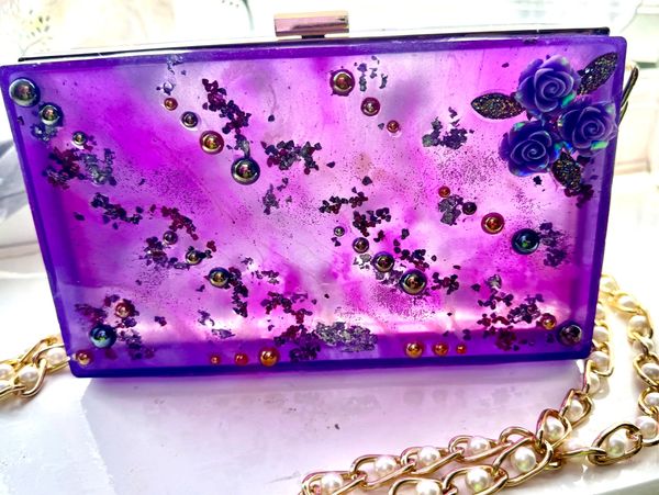 Beautifully unique purple resin bag with flowers and Sparkle chips. 