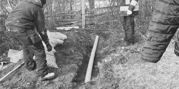 Team working on the exterior water lines.