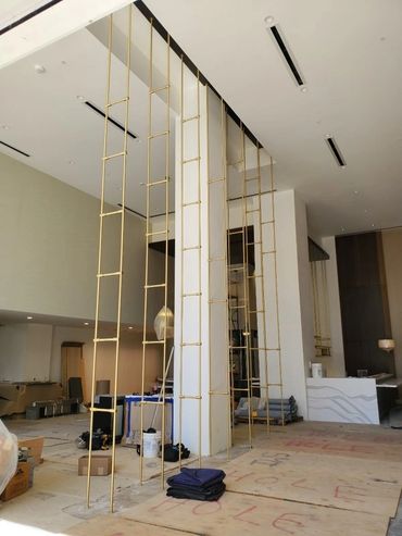 Watermark at Westwood Los Angeles, brass shelving unit and stemware hanging rack.