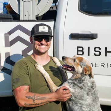 Luke Bishop and one of his dogs, Spur.