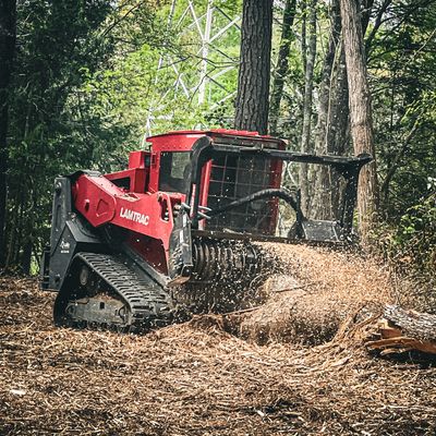Lamtrac unit mulching a downed tree
