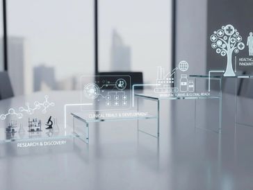 Glass blocks illustrate stages from research to healthcare progress in a modern office.