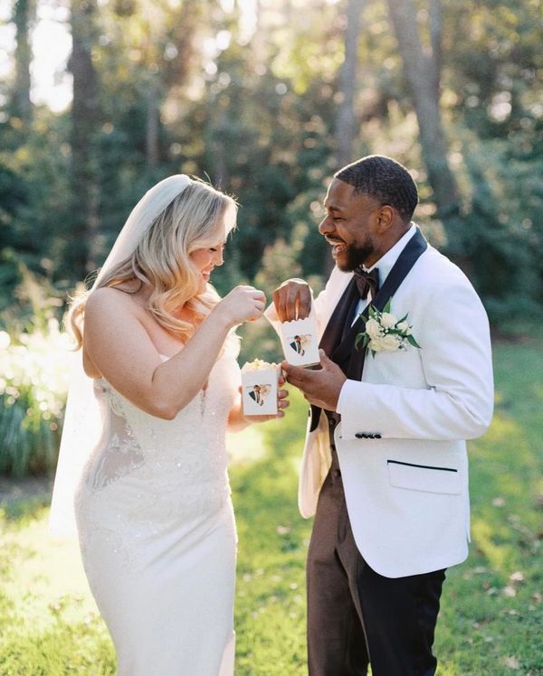 a couple at their wedding enjoying our popcorn