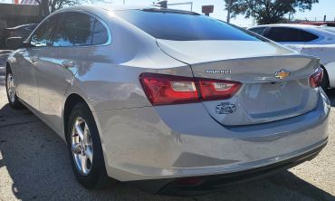 Rear view of a silver Chevrolet Malibu car.