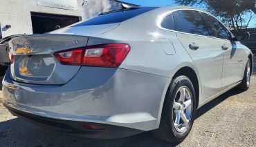 Rear view of a silver Chevrolet Malibu LT.