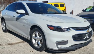 White Chevrolet Malibu sedan parked outdoors.