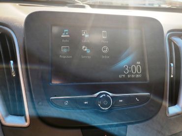 Car infotainment system displaying various controls and the time.