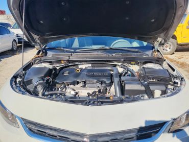 Open hood showing a Chevrolet Ecotec engine.