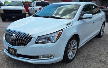 White Buick sedan parked outdoors.