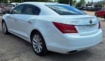 White Buick sedan parked outdoors.