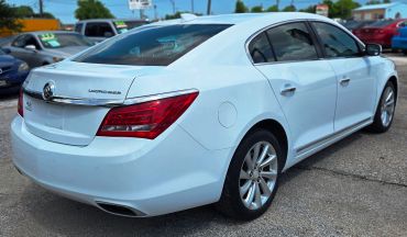 Rear view of a white Buick LaCrosse car parked outdoors.