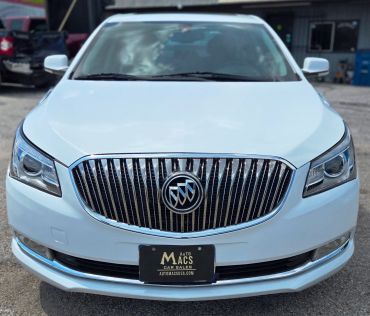 Front view of white Buick car with distinctive grille and headlights.